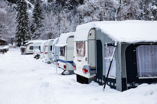 Row of RVs stored outside in winter conditions