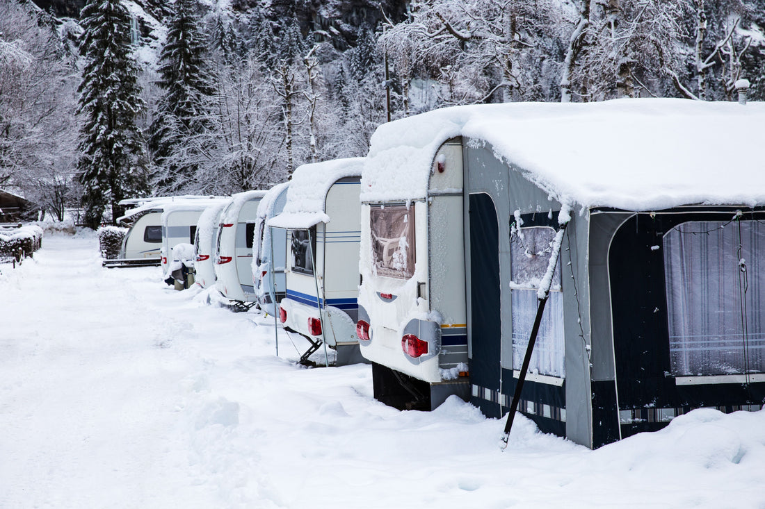 Row of RVs stored outside in winter conditions