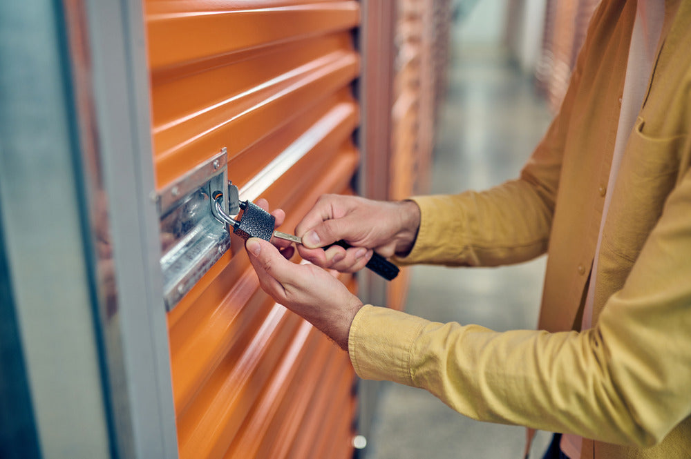 Someone unlocking storage unit