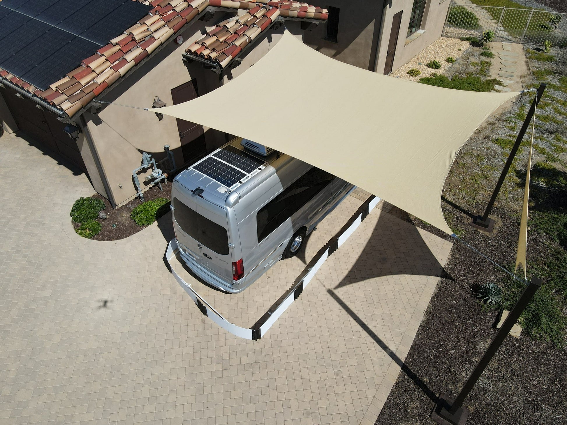 Caper van parked outdoors with a Box-Kat mouse barrier