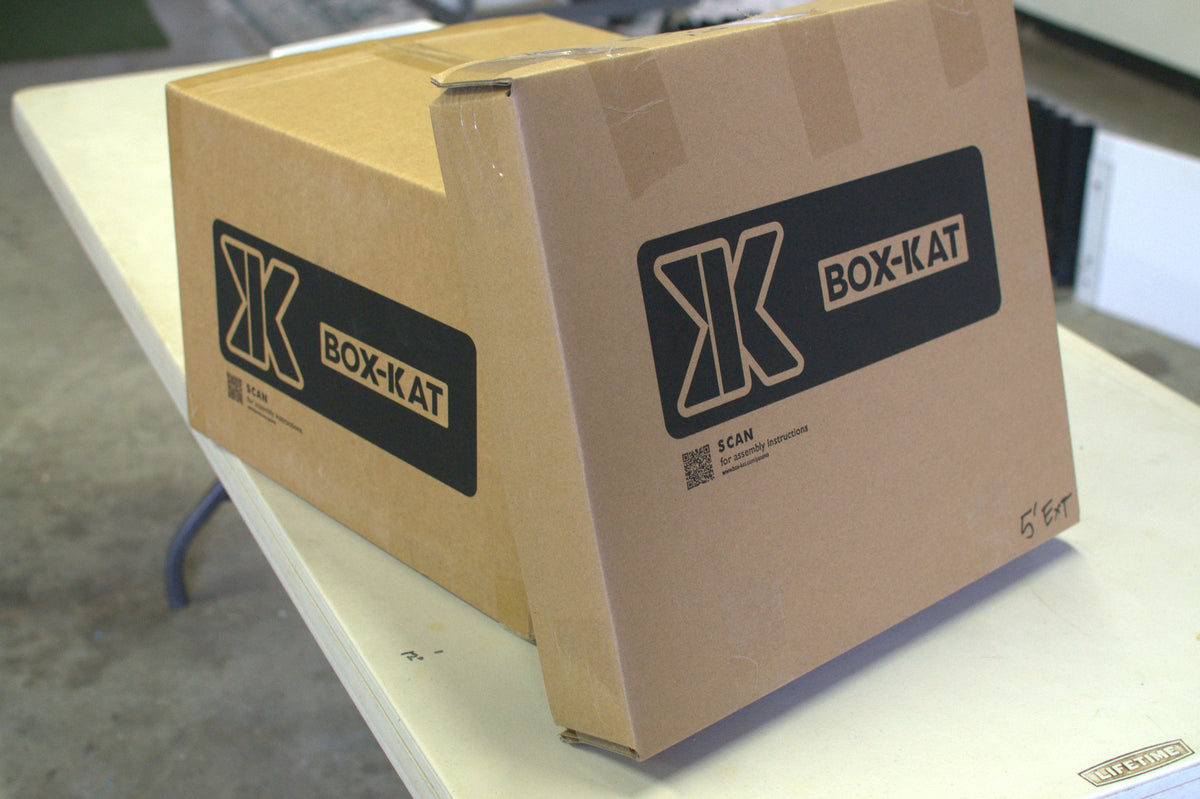 Box-Kat kit in its shipping box on a workbench
